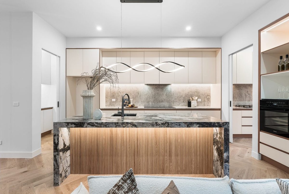Kitchen island with sculptural pendant lighting