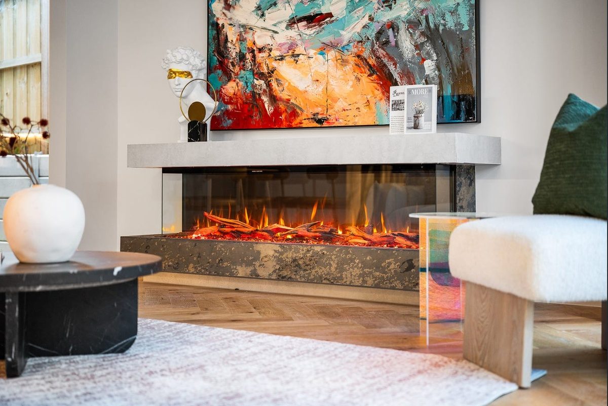 Living room mantle styling above a linear gas fireplace